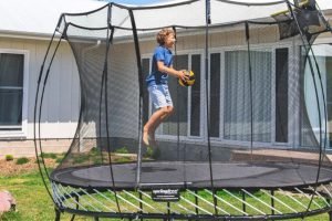 Which Surfaces Work Best for Backyard Trampolines?